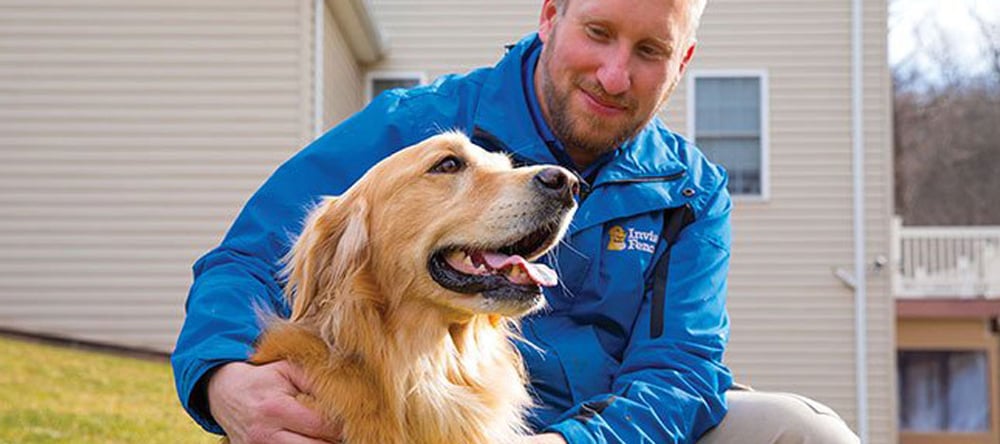 Invisible Fence Brand Trainer with a dog